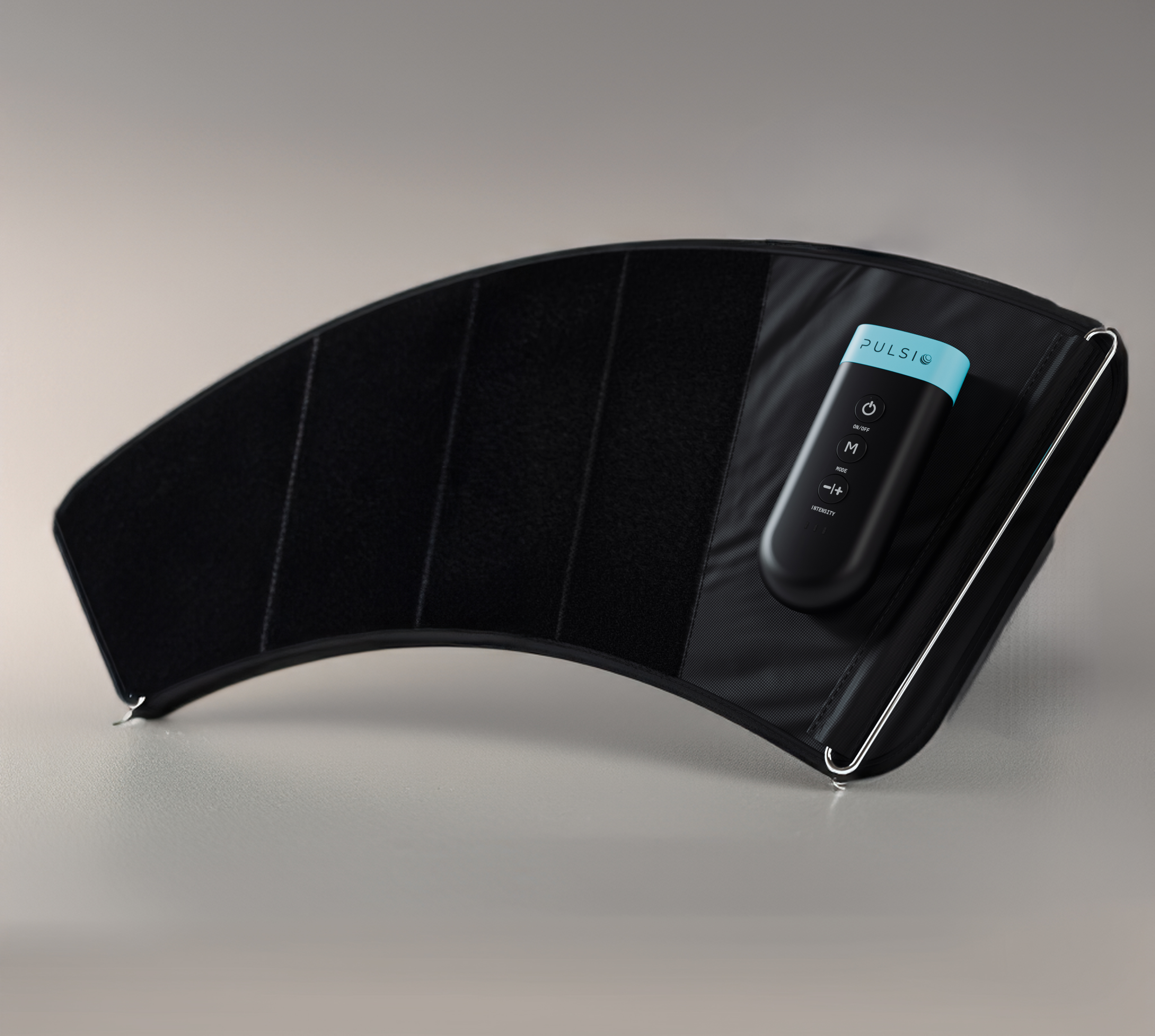 Person wearing an arm muscle stimulator device with a control panel visible.