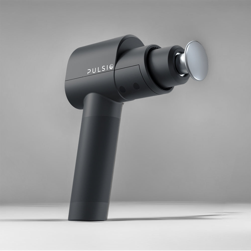 Black Pulsio massage gun on a gray background.