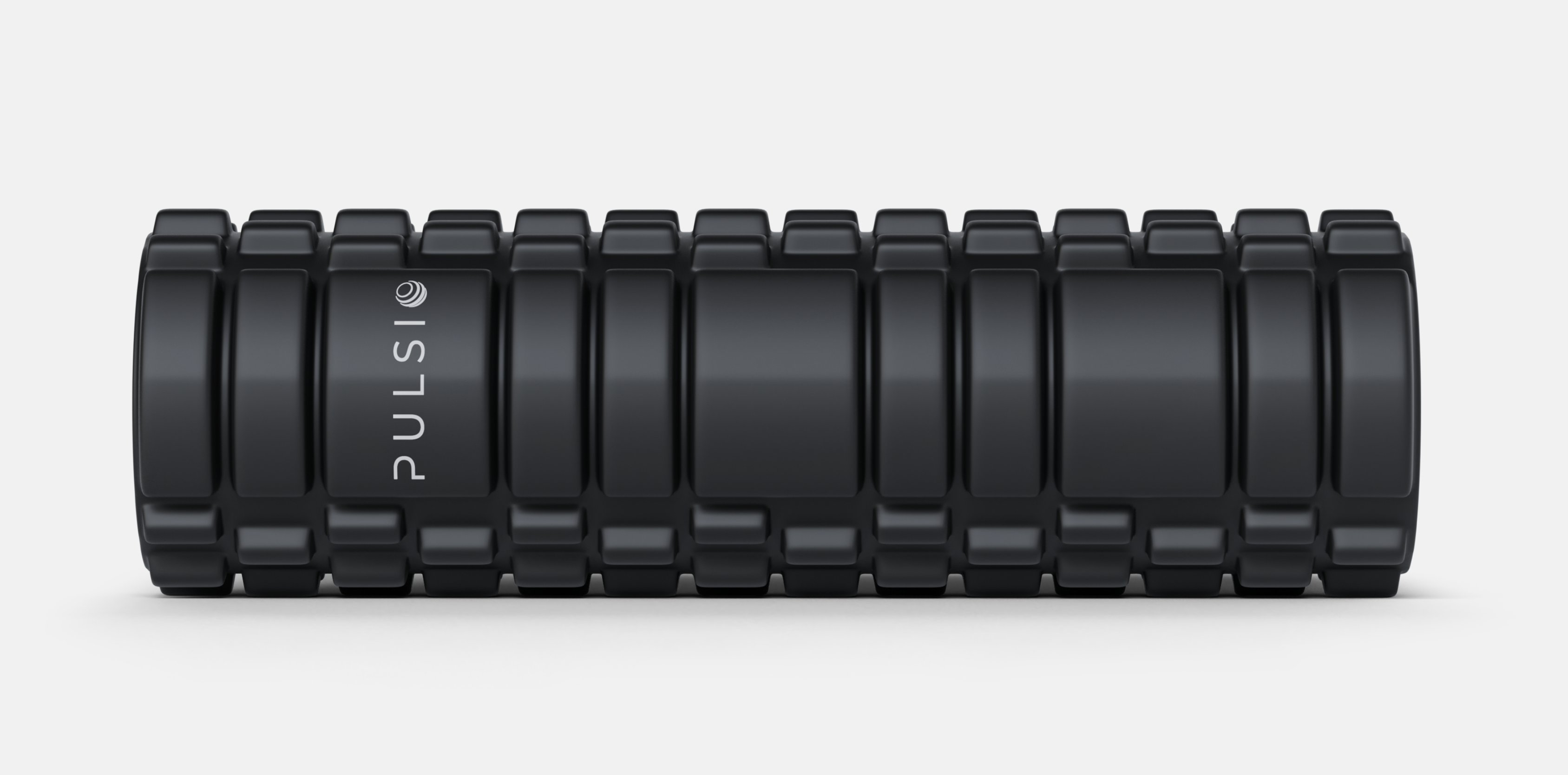 Man seated, looking at sensor on tattooed arm in a locker room.