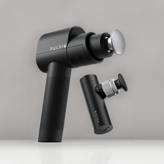 Black Pulsio massage gun on a gray background.