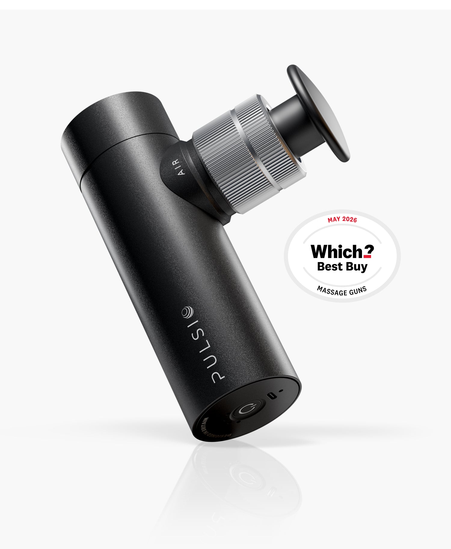 A black and silver Pulsiq Pro handheld massage gun angled on a grey reflective surface.