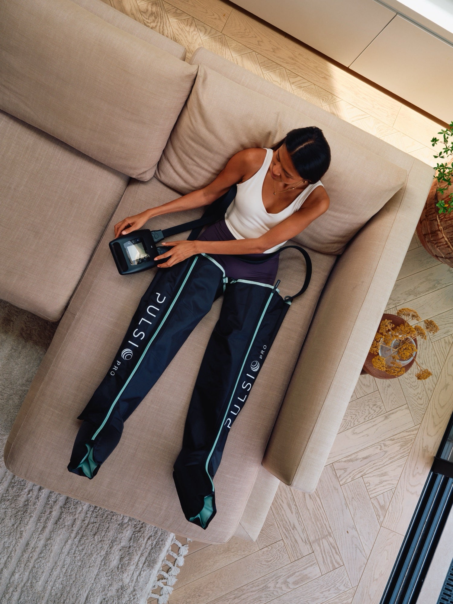Compression PRO boots in use on the sofa