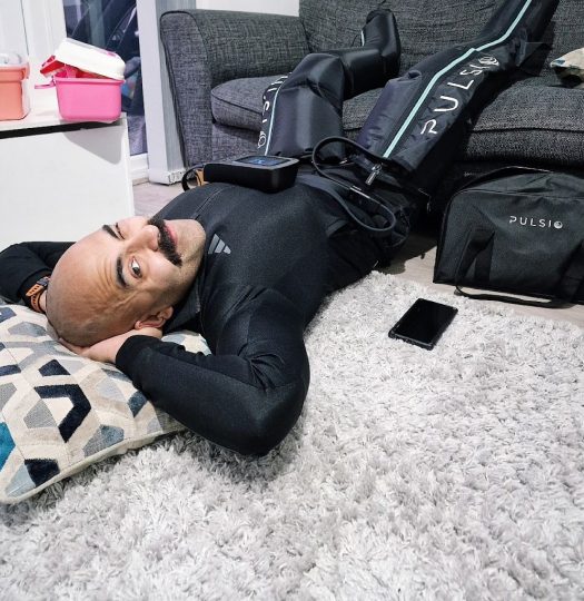 Relaxing on the floor in Pulsio Compression boots
