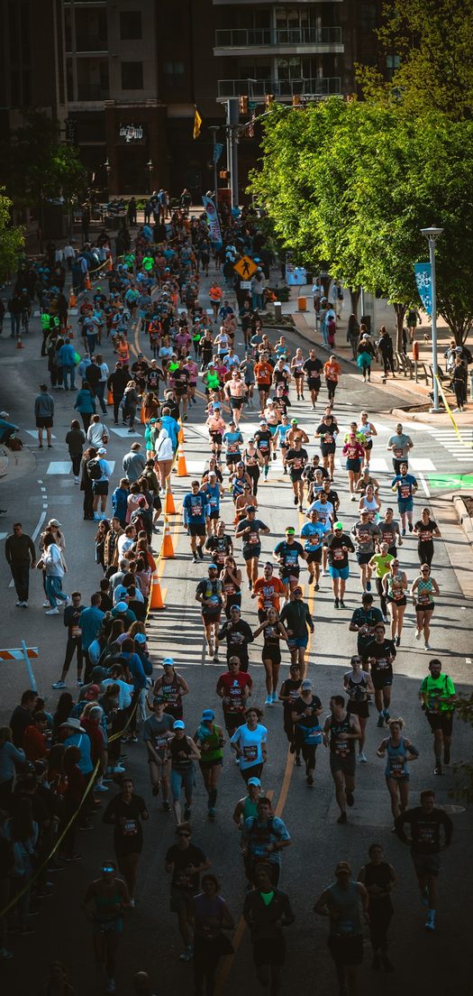 Runners filling a city street during a marathon
